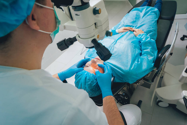 patient and surgeon in operating room during ophthalmic surgery - Фото, зображення