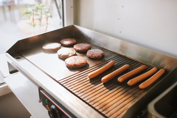 sausages and meat cutlets for burgers in food truck - Fotoğraf, Görsel
