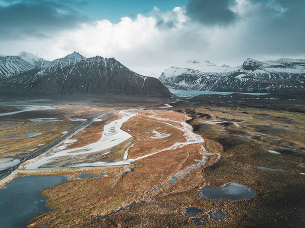 Vatnajokull glacier aerial drone image with street highway and clouds and blue sky. Dramatic winter scene of Vatnajokull National Park, Iceland, Europe. Beauty of nature concept background. - Foto, Bild