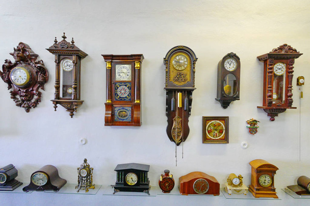 Exposition with a huge number of different ancient wooden clockwork mechanisms - 写真・画像