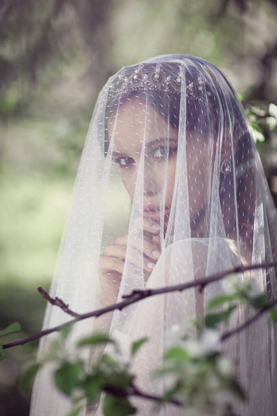 Beautiful young bride in a blooming garden - Foto, immagini