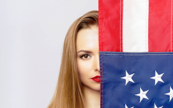 Pretty blond girl with USA flag. - Photo, Image