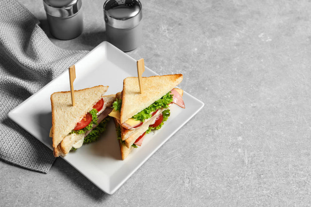 Tasty toast sandwiches on plate. Wheat bread - Foto, Imagen