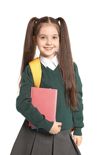 Little girl in stylish school uniform on white background - Фото, зображення