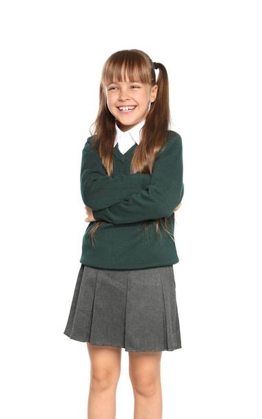 Little girl in stylish school uniform on white background - Zdjęcie, obraz