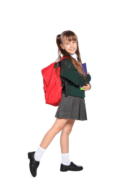 Little girl in stylish school uniform on white background - Fotoğraf, Görsel