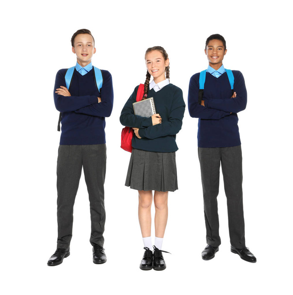 Teenagers in stylish school uniform on white background - Zdjęcie, obraz