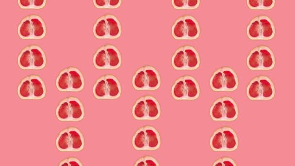 Grapefruit animation on pink background.Grapefruit halves are moving from bottom and from top (three strips from bottom and four strips from top then all stripses move forward) to the center of screen. - Footage, Video