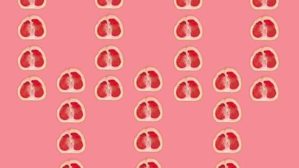 Grapefruit animation on pink background.Grapefruit halves are moving from bottom and from top (three strips from bottom and four strips from top then three strips move forward) to the center of screen. - Footage, Video