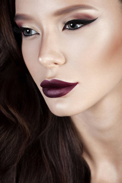 Luxurious young woman with perfect make-up with purple lipstick. Beauty close-up portrait - Фото, зображення