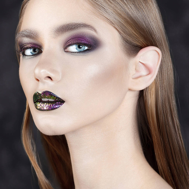 Young beautiful girl with purple make-up. Beauty close-up portrait - Photo, Image