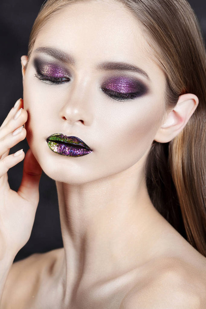 Young beautiful girl with purple make-up. Beauty close-up portrait - Foto, imagen
