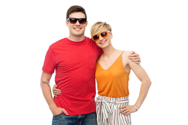 couple in sunglasses hugging over white background - Photo, image