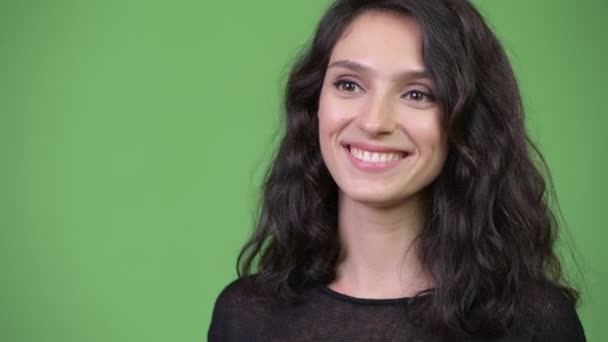 Young happy beautiful woman smiling - Filmati, video