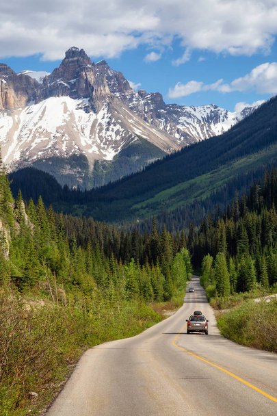 Scenic road in the Canadian Rockies during a vibrant sunny summer day. Taken in Yoho National Park, British Columbia, Canada. - Photo, image