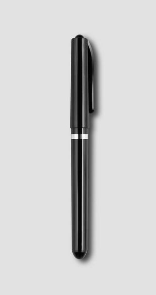 Black felt pen isolated on grey background - Fotó, kép