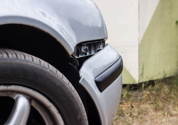 A car with a broken front bumper, close up, crash - Zdjęcie, obraz