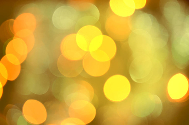  抽象的な金速運動。黄金の光ボケ モーション背景。レトロなスタイルのトーン。クリスマス ゴールドのガーランド ライト - 写真・画像