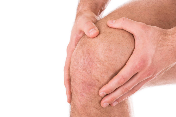 Man with knee pain over white background - Photo, Image