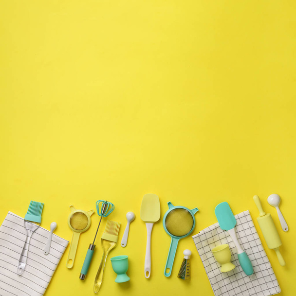 Turquoise cooking utensils on yellow background. Food ingredients. Cooking cakes and baking bread concept. Copy space. Top view. Flat lay - Photo, Image