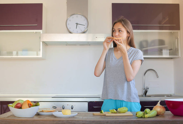 Young woman having breakfast at home. - Valokuva, kuva