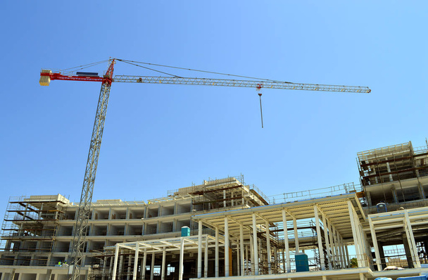 A crane constructing a new hotel in Paphos - Photo, Image