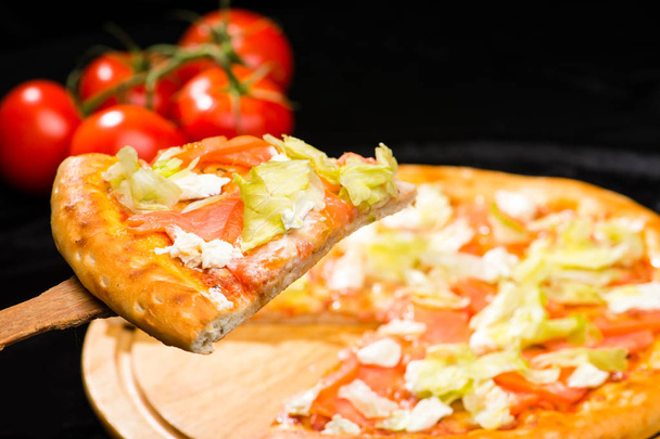 selective focus on sliced piece of appetizing Italian pizza with - Photo, Image