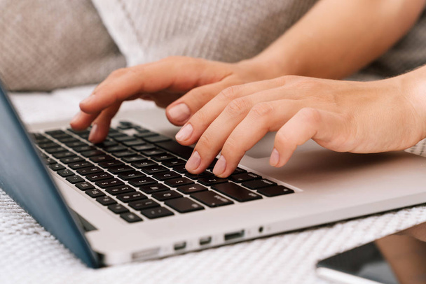 Female fingers typing on laptop keyboard. - Photo, Image