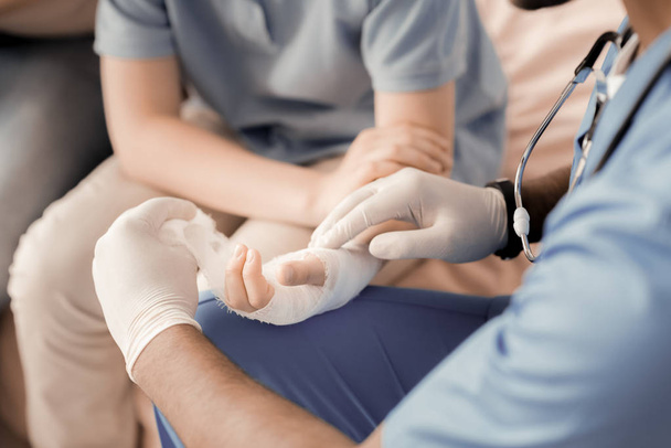 Close up of doctors hands that holding bandage - Φωτογραφία, εικόνα