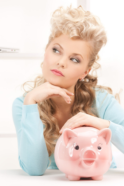Lovely woman with piggy bank - Foto, Imagen