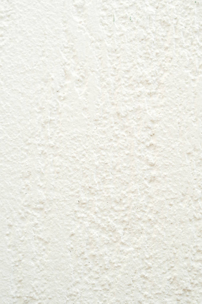 primer plano de la representación de fachada blanca con acabado crudo, estilo meditarráneo típico
 - Foto, Imagen