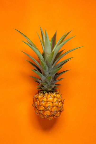 Fresh Pineapple In the orange background - Foto, Bild