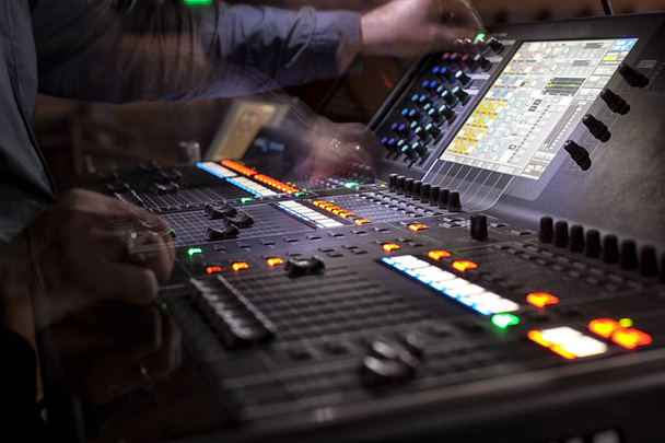 music, technology, people and equipment concept - hands using mixing console in sound recording studio - Photo, Image