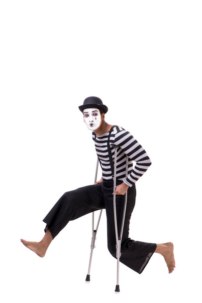 Mime with crutches isolated on white background - Foto, imagen