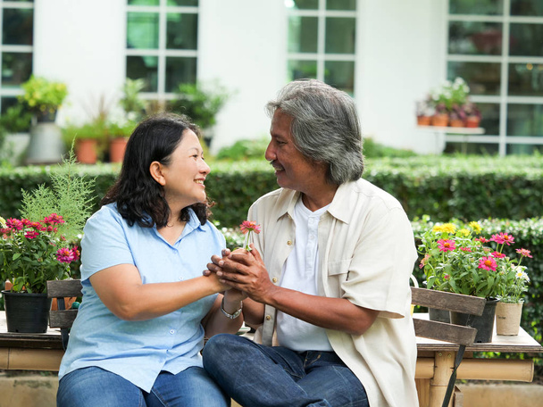 Smiling happy asian elderly couple lover at outdoor. - Foto, imagen