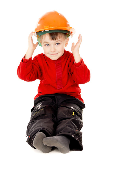 happy little boy sits with a helmet - Foto, afbeelding