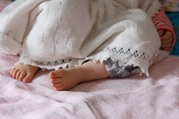 legs of a one year old sleeping little girl - Photo, image