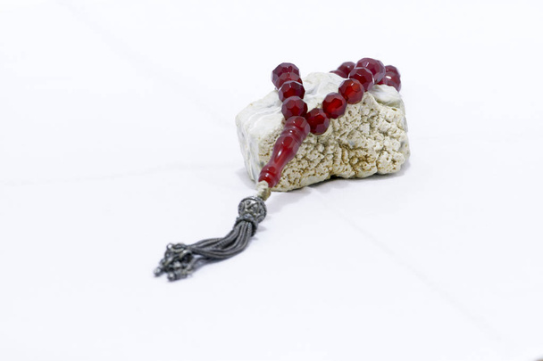 Religious rosary on white ground - Photo, Image