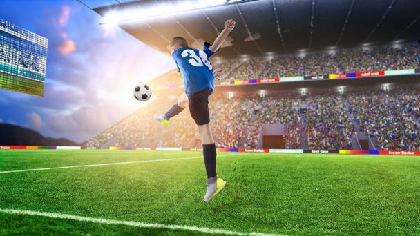 jugador de fútbol infantil golpeando la pelota en un estadio de fútbol
 - Foto, Imagen