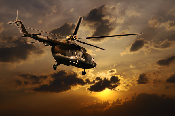 Hélicoptère au coucher du soleil
 - Photo, image