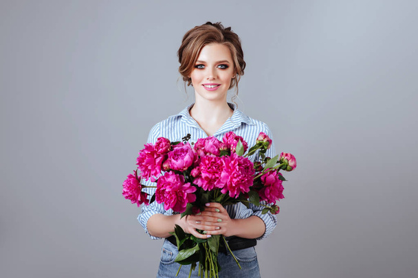 Fashion beautiful model with flowers , spring look. - Photo, Image