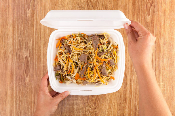 Delicious noodles in take away box from above. - Photo, Image