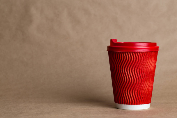 coffeeto  go in a disposable cup on a craft background, place for tex - 写真・画像