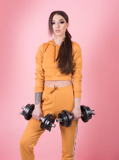 trainer. trainer woman with barbell. sport trainer in gym. weight lifting trainer. exercising with barbells. - Fotoğraf, Görsel