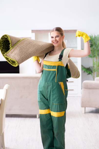 Professional female cleaner cleaning carpet - Photo, Image