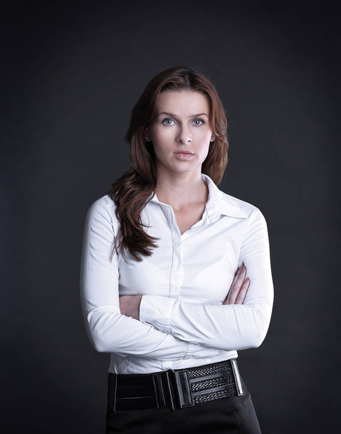 portrait of confident business woman .isolated on dark - Zdjęcie, obraz