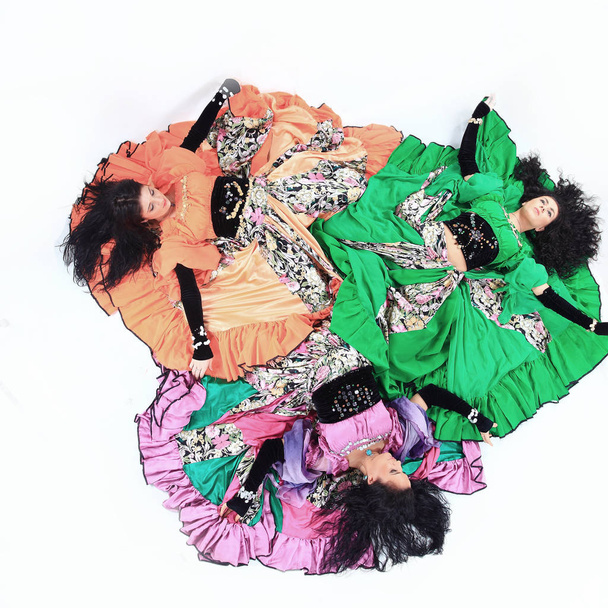 Gypsy dance group in national costumes performing folk dance. - Photo, image