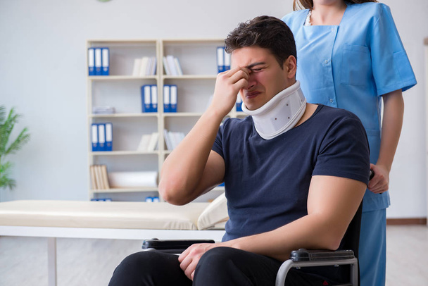 Man with neck injury visiting doctor for check-up - Photo, Image