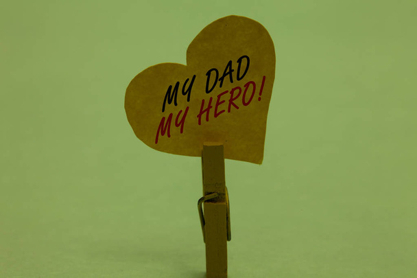 Handwriting text My Dad My Hero. Concept meaning Admiration for your father love feelings emotions compliment Celadon color background paper clip hold love heart for loving with words - Photo, Image