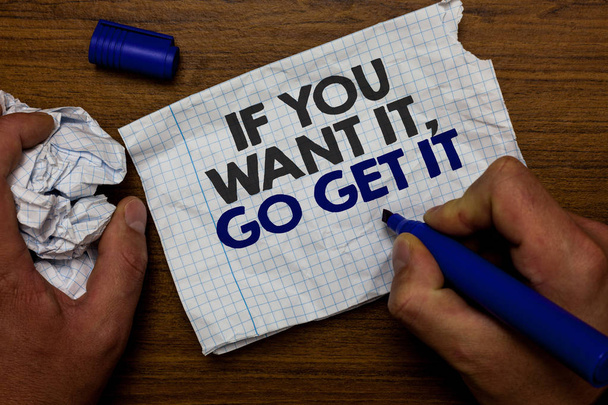 Текст для написания слов If You Want It, Go Get It.. Бизнес-концепция для осуществления действий для достижения ваших целей пожелания держать бумажный лоскут и синий маркер деревянной основы с разорванной белой написанной страницы
 - Фото, изображение